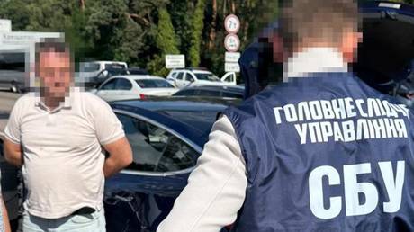 Ukrainian ecurity officials arrest an anti-corruption investigator accused of working for Russia.