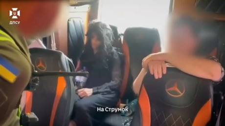 Ukrainian man resorts to cross-dressing in bid to flee country – officials (VIDEO)