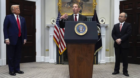 Oracle CEO Larry Ellison, center, speaks as President Donald Trump, left, and Masayoshi Son, SoftBank Group CEO, listen in the Roosevelt Room at the White House, Tuesday, Jan. 21, 2025, in Washington DC.