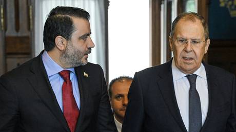 Syrian Foreign Affairs and Expatriates Minister Asaad al-Shaibani and Russian Foreign Minister Sergey Lavrov arrive for a meeting in Moscow, Russia.