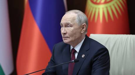 Russian President Vladimir Putin attends a narrow format meeting of the Collective Security Treaty Organization (CSTO) summit at the Yntymak Ordo Presidential Administration in Bishkek, Kyrgyzstan.