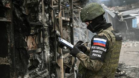 FILE PHOTO. An investigator inspects a burned firefighting vehicle at a gas station in Tokmak (Zaporozhye region) after a Ukrainian drone strike on February 3, 2024.