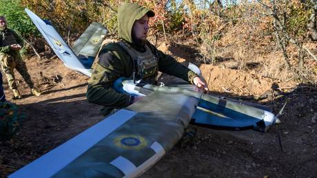 FILE HOTO: A Ukrainian soldier preparing a drone for launch.