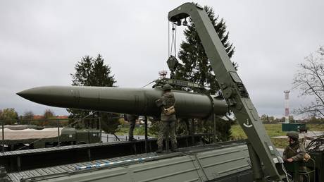 FILE PHOTO. Russian servicemen loading an Iskander-M ballistic missile launcher.
