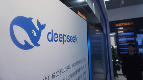 A visitor walks by the display board of DeepSeek at a mall in Hangzhou, China, April 23, 2026