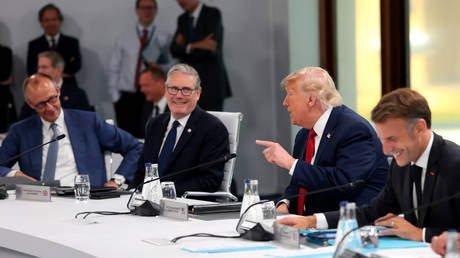 British Prime Minister Keir Starmer and US President Donald Trump talk at the G7 Summit on June 17, 2026, in Evian-les-Bains, France.