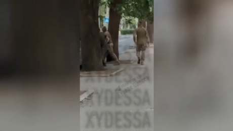 Ukrainian press gang attacks dog in disturbing revenge act (VIDEO)