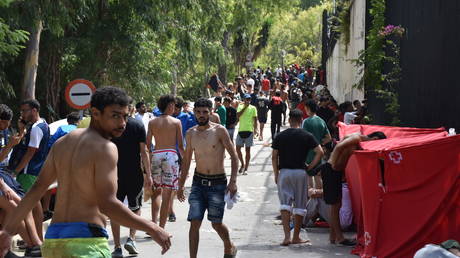 Migrants crowd a Temporary Immigrant Reception Centre (CETI) in Ceuta, Spain, July 30, 2026